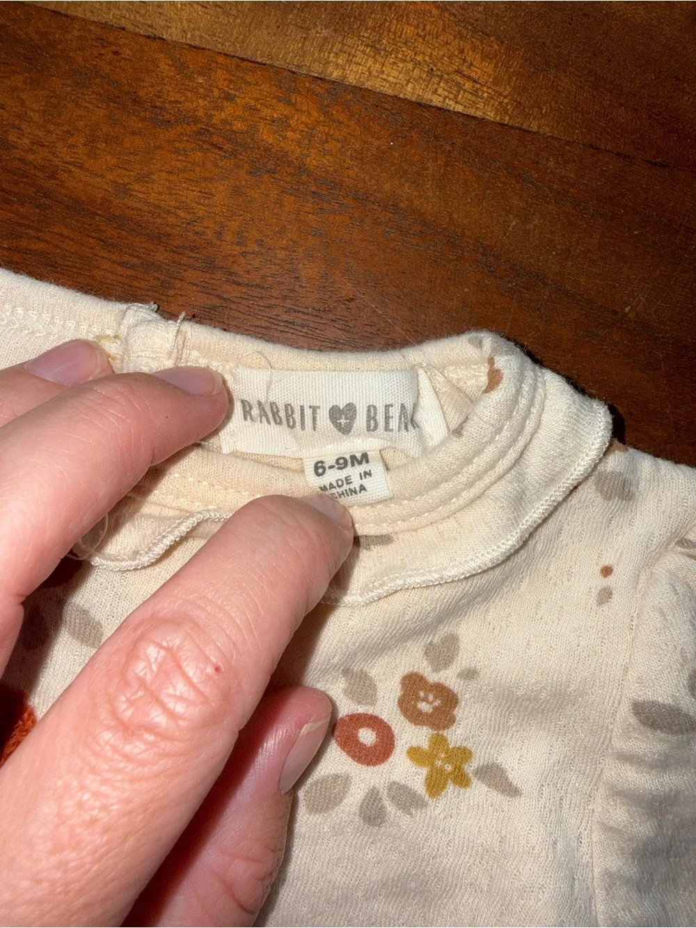 Cream‎ Floral Long-Sleeve Baby One-Piece with Rust Flower Applique